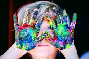 A child painted his hands at Moranba Early Learning Centre